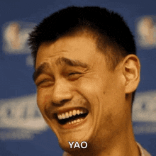 a man is making a funny face and the word yao is on the bottom right