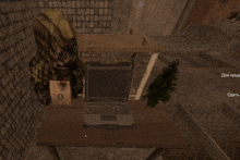a computer screen shows a person sitting at a desk with a laptop