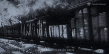 a black and white photo of a train with the words " and the battle is going again "