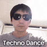 a man wearing sunglasses has the words techno dance written on his shirt