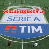soccer players on a field with a sign that says serie a