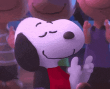 a close up of snoopy with his eyes closed and a red scarf around his neck