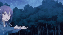 a girl in a blue jacket is reaching out towards the sky