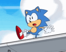 a cartoon of sonic the hedgehog standing on top of a building