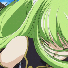 a close up of a girl with green hair and a black shirt