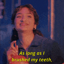 a woman drinking from an apple with the words " as long as i brushed my teeth "