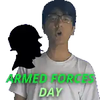 a man wearing glasses and a white shirt with the words armed forces day