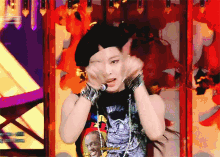 a woman wearing a snoop dogg t-shirt makes a face
