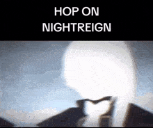 a person is making a heart shape with their hands in front of a light that says hop on nightreign .