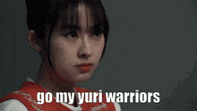 a girl says " go my yuri warriors " in front of her