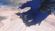 a close up of a person 's hand wearing a blue glove