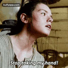 a close up of a woman 's face with the words `` stop taking my hand '' .