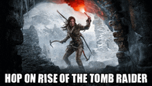 a poster for the tomb raider shows a woman holding a torch