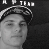 a man wearing a hat that says a team