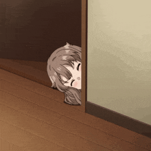 a girl peeking out from behind a door with her eyes closed
