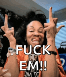 a woman is making a funny face and says fuck em