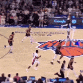 a basketball game is being played on a court sponsored by google