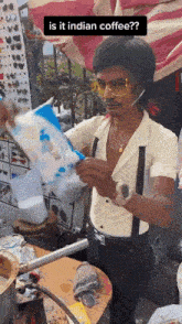 a man is holding a bag of cotton candy and asking if it is indian coffee .