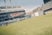 a man in a superman costume running on a baseball field