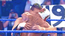 Eddie Guerrero Rey Mysterio GIF - Eddie Guerrero Rey Mysterio Hug GIFs