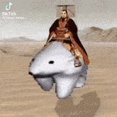 a man is riding on the back of a polar bear in the desert ..