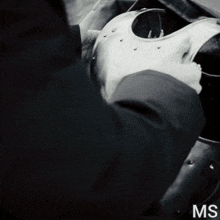 a black and white photo of a person with the letters ms on the bottom right