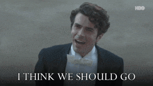 a man in a tuxedo and bow tie with the words into business together below him