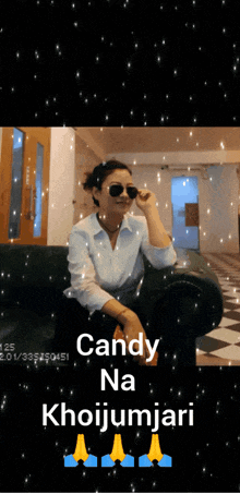 a woman wearing sunglasses sits on a couch with the words candy na khoijumjari written below her