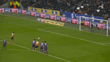 soccer players on a field with ads for sky bet betting better