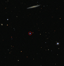 a red circle in the middle of a black background
