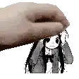 a hand is putting a cartoon character on top of a girl .