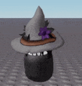 a white witch hat with a purple flower on it