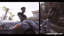 a man is sitting on the hood of a car and another man is standing next to him