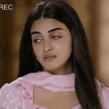 a woman in a pink dress is making a funny face with rec written in the corner