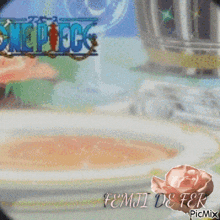 a picture of a one piece logo with a pink rose in the foreground