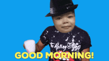 a child wearing a rolling stones shirt is holding a cup