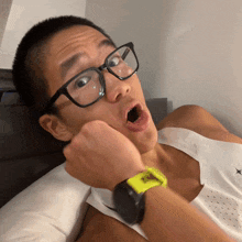 a man wearing glasses and a watch that says ' sd ' on it