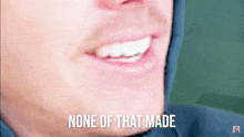 a close up of a man 's face with the words " none of that made " above it