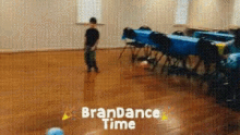 a boy is dancing in a room with the words brandance time written on the floor