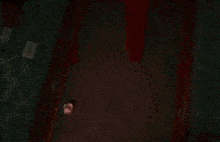 a person is holding a knife in front of a door in a room with red smoke coming out of it .