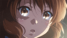 a close up of a girl 's face with tears running down her cheeks