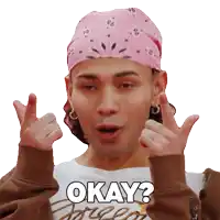 a man wearing a bandana and a white shirt says okay