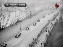 a black and white photo of a military parade with the number 19 on the bottom right