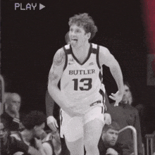 a basketball player wearing a butler jersey number 13