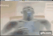 a close up of a person 's face with glowing eyes and a gifs.com button in the corner .
