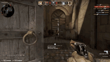 a person holding a gun in front of a wooden door
