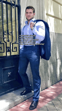 a man in a suit is standing in front of a building with the words o sambaja placuta