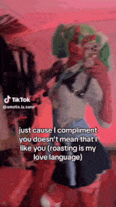 a woman is taking a picture of herself with a cell phone and a caption that says tiktok