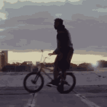 Dumping The Bicycle Nigel Sylvester GIF