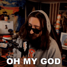 a man wearing sunglasses says oh my god